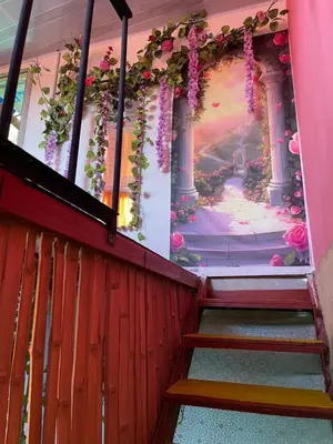 a staircase in a building with a painting on the wall at El eden in Manizales