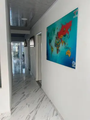 a painting of a world on a wall in a hallway at Black and White Mariquita Tolima in Mariquita