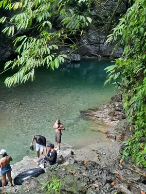 a group of people in the water near a river at Apartamento Barbie 3 in Mutatá