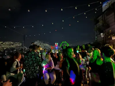 a crowd of people at a party at night at Los Patios Cool Living in Medellín
