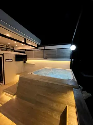 a jacuzzi tub in a building at night at Duplex con jacuzzi y terraza privada in Santa Fe de Antioquia