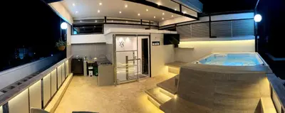 a large bathroom with a hot tub in a building at Duplex con jacuzzi y terraza privada in Santa Fe de Antioquia