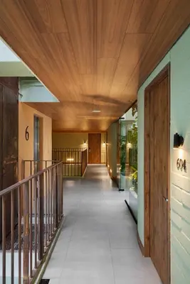 a hallway of a building with a wooden ceiling at Wellcomm Spa & Hotel in Medellín