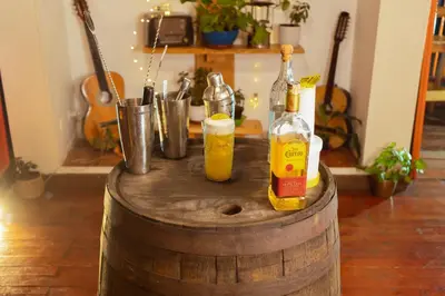 two bottles of alcohol sitting on top of a barrel at Hotel Colonial Abejorral in Abejorral