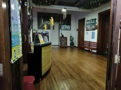 a room with a counter and a wooden floor at HOTEL GIRASOLES in Manizales