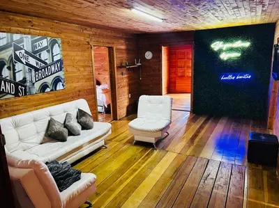 a living room with a couch and two chairs at Casa madera in Jardin