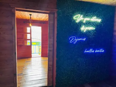 a door to a room with a blue wall at Casa madera in Jardin