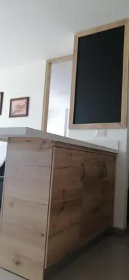 a television sitting on top of a wooden cabinet at Santafé Di sole in Santa Fe de Antioquia