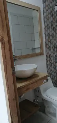 a bathroom with a sink and a toilet at Santafé Di sole in Santa Fe de Antioquia