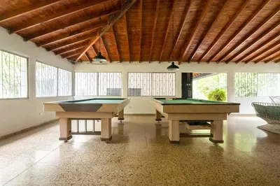 two pool tables in a large room with windows at Finca La Maria: Recreo y naturaleza (22 personas) in Santa Fe de Antioquia
