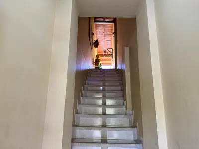 a staircase leading up to a building with a stair case at Sol Apartamentos Doradal in Doradal