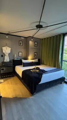 a bedroom with two beds in a room at Hotel Helene in Medellín