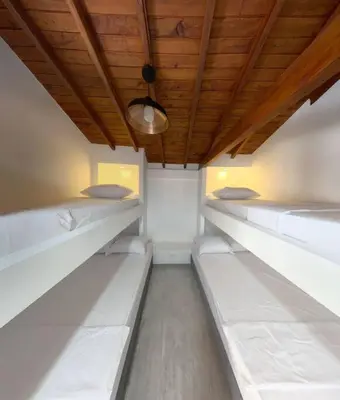 a row of bunk beds in a room at Apto frente al Malecón, Ubicación fantástica, Vista in Guatapé