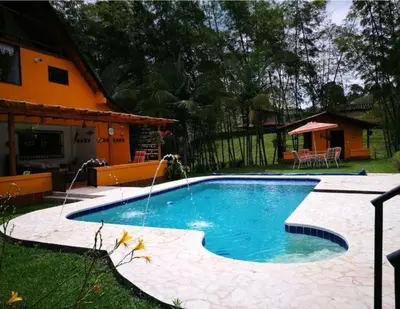 a swimming pool in the backyard of a house at Volare Guatapé isla de descanso y retiro in Guatapé