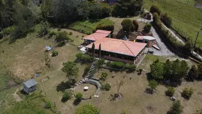 an aerial view of a house with a playground at Casa de Campo vía El Peñol Guatapé in Marinilla