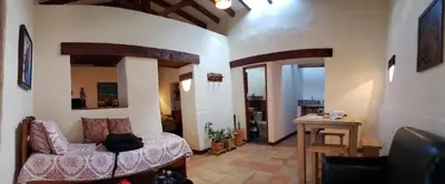 a living room with a couch and a table at Recinto Alfaro in Concepción