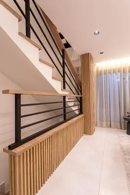a staircase in a house with wooden railings at Jacuzzi Privado, Casa de Lujo Norte Medellin in Medellín