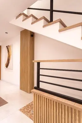 a staircase in a room with white walls at Jacuzzi Privado, Casa de Lujo Norte Medellin in Medellín