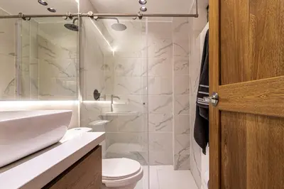 a bathroom with a shower and a toilet and a sink at Jacuzzi Privado, Casa de Lujo Norte Medellin in Medellín