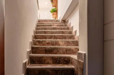 a set of stairs in a building at Cozy Apartment with A/C in North Medellin. in Medellín