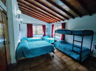 a bedroom with two bunk beds and a window at Gran Tierra - Sabaneta in Medellín