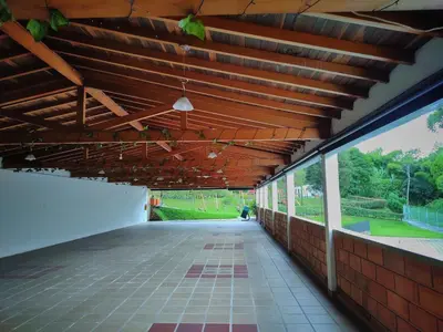 an empty hallway of a building with a wooden ceiling at Gran Tierra - Sabaneta in Medellín