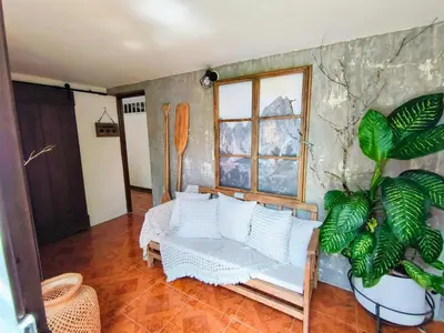a living room with a couch and a window at Hermosa Finca El Castillo - Excelente Ubicación Rionegro Marinilla in Rionegro