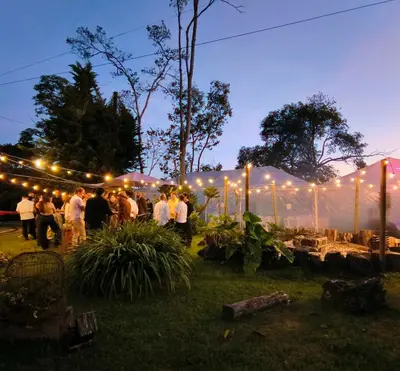 a group of people standing under a tent with lights at Hermosa Finca El Castillo - Excelente Ubicación Rionegro Marinilla in Rionegro