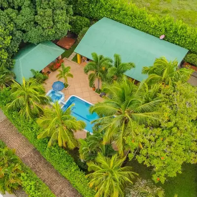 an overhead view of a resort with a pool and palm trees at Casa Guali in Honda