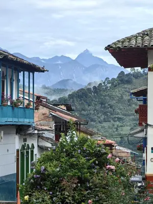 a view of a town with mountains in the background at Hotel Colonial in Jardin