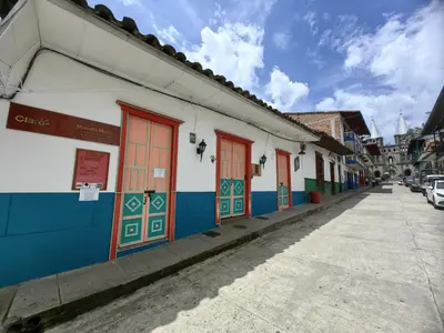 a street with colorful doors on a building at Hotel Colonial in Jardin