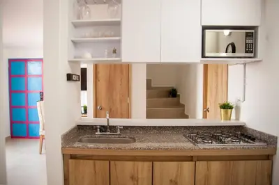 a kitchen with a sink and a counter top at Cozy Apartment Rocks Guatape in Guatapé