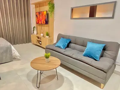 a living room with a couch and a table at Apartamento en Laurels Medellín in Medellín