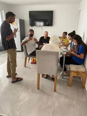a group of people sitting around a table in a room at Gaston2 in Medellín
