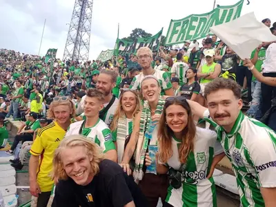 a group of people posing for a picture at a soccer game at Gaston2 in Medellín