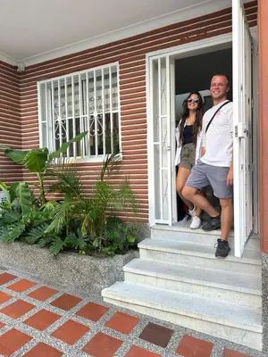 two people standing on the porch of a house at Gaston2 in Medellín