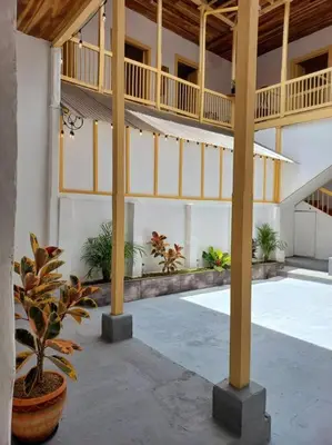 a large building with a courtyard with plants in it at Casa típica Salamineña in Salamina