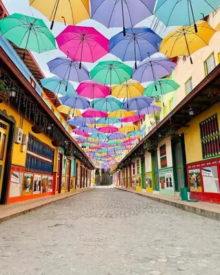a bunch of umbrellas hanging over a street at Aparta Suite Torre De Prado Penthouse in Medellín