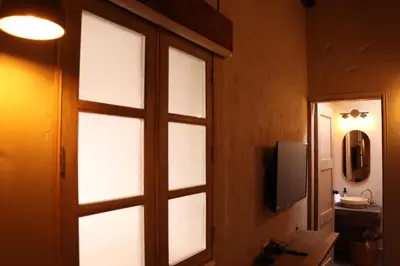 a door with a window in a room with a sink at Valerio Hotel Boutique in Marinilla