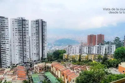 a view of a city with tall buildings at RentalsOP AN01 Apto cerca al lleras con balcon y piscina climatizada, cerca a provenza, ubicado min del aeropuerto in Medellín