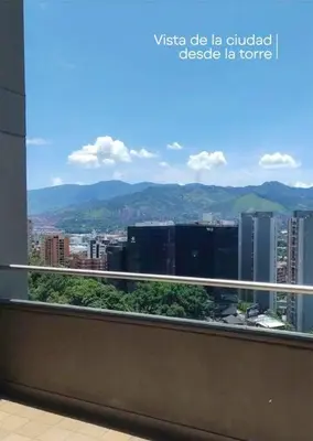 a balcony with a view of a city at RentalsOP AN01 Apto cerca al lleras con balcon y piscina climatizada, cerca a provenza, ubicado min del aeropuerto in Medellín