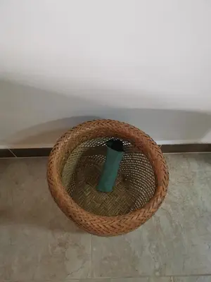 a bamboo basket with a green vase in it at La Lunar un espacio ideal para trabajar y conocer Medellín in Medellín