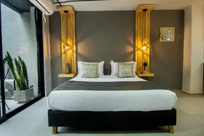 a bedroom with a large bed in a room at Barcelo Coliving in Medellín