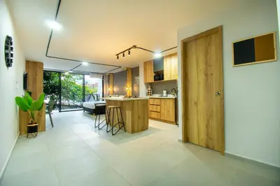 a kitchen with a island in the middle of a room at Barcelo Coliving in Medellín