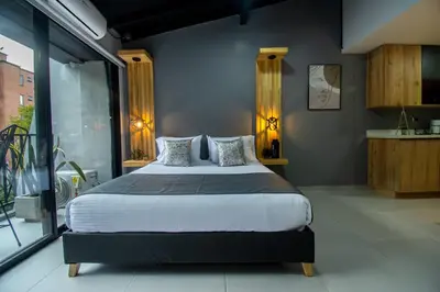 a bedroom with a large bed in a room at Barcelo Coliving in Medellín