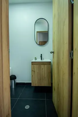 a bathroom with a sink and a mirror at Barcelo Coliving in Medellín