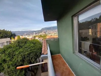 a balcony with a view of a city at Los balconesll in Medellín