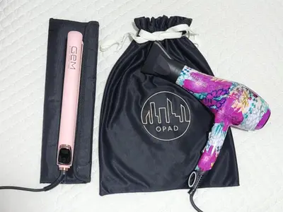 a black bag with a pink pen in it at Modern High-Rise 2/2 Apartment with City View. in Sabaneta