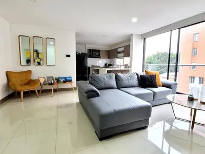 a living room with a couch and a table at New Luxury 3 Bedroom Apartment in Great Area. in Medellín