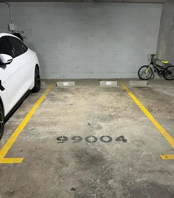 a white car parked in a parking garage at New Luxury 3 Bedroom Apartment in Great Area. in Medellín